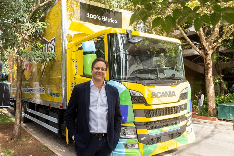 PepsiCo Brasil President standing with PepsiCo electric truck