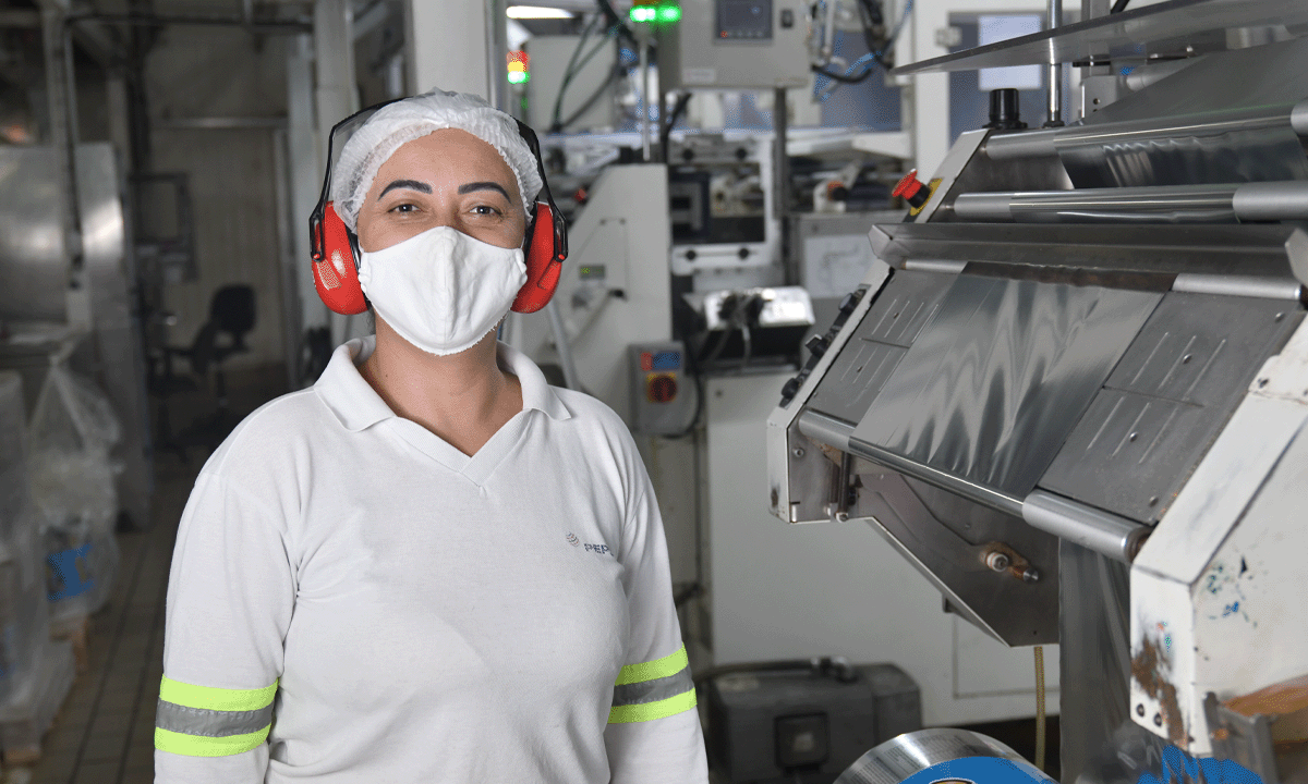 Associate wearing protective equipment in a distribution center