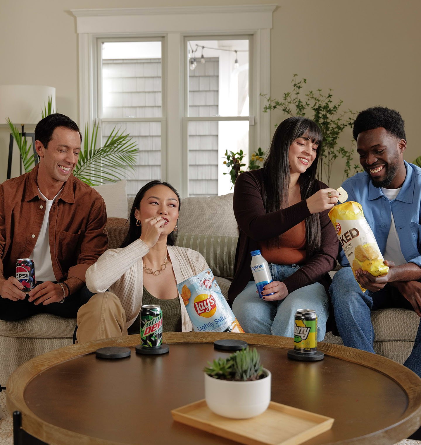 Friends enjoying a variety of PepsiCo foods and beverages